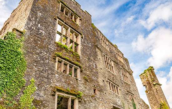 A ruined castle with large windows