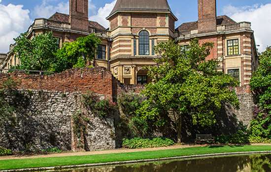 A grand palace overlooking a river